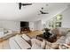 Comfortable living area featuring hardwood floors, a sectional sofa, and a large flat-screen TV at 5416 Woodcreek Dr, Charlotte, NC 28226