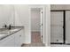 Bathroom featuring double vanity with granite counters and a glass-enclosed shower at 5711 Skinny Down, Charlotte, NC 28215