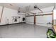 Spacious two car garage featuring epoxy flooring, tools, storage, and automated doors at 6013 Coaching Inn Ct, Charlotte, NC 28270
