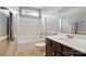 Well-lit bathroom featuring a combination tub and shower with a neutral color scheme at 7371 Vanguard Ct, Stanley, NC 28164