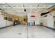 Spacious garage with ample storage and room for multiple vehicles and workbench at 7371 Vanguard Ct, Stanley, NC 28164