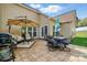 Expansive stamped concrete patio with comfortable seating, dining area, and well-manicured lawn at 7371 Vanguard Ct, Stanley, NC 28164
