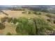 Aerial view of home and property with surrounding trees and farmland at 751 & 767 Pettit Rd, Catawba, SC 29704