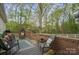Well furnished back deck has chairs, a table, and nice wooded view at 751 & 767 Pettit Rd, Catawba, SC 29704