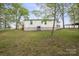 Side view of the home with a small deck and a glimpse of the carport at 751 & 767 Pettit Rd, Catawba, SC 29704