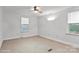 Neutral bedroom features carpeted floors and windows with natural light at 751 & 767 Pettit Rd, Catawba, SC 29704