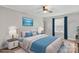 Stylishly staged bedroom with blue accents, including a blue throw and matching curtains at 751 & 767 Pettit Rd, Catawba, SC 29704