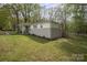 A beautiful view of the home from the side yard, featuring white fencing and lush greenery at 751 & 767 Pettit Rd, Catawba, SC 29704