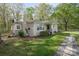 Angle view of the home exterior showing the chimney, porch, and landscaped side yard at 751 & 767 Pettit Rd, Catawba, SC 29704