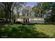 Well-lit home exterior at twilight features a covered porch and manicured lawn at 751 & 767 Pettit Rd, Catawba, SC 29704