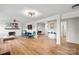 Open-concept living room with fireplace, wood floors, and stylish furnishings at 751 & 767 Pettit Rd, Catawba, SC 29704