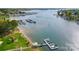 Stunning aerial view of a waterfront property with a private dock and boat access on a beautiful lake at 7836 Village Harbor Dr, Cornelius, NC 28031