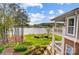 Multi-story home with beautiful landscaping has a lakeside view and brick accents at 7836 Village Harbor Dr, Cornelius, NC 28031