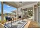 Cozy covered patio with seating and scenic views of the water, perfect for relaxing outdoors at 7836 Village Harbor Dr, Cornelius, NC 28031