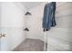 Spacious walk-in closet features white wire shelving and neutral colored carpet at 7836 Village Harbor Dr, Cornelius, NC 28031