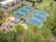Aerial view of community tennis courts and a park for a leisurely and active lifestyle at 791 Seigle Point Dr, Charlotte, NC 28204