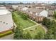 Aerial view of townhomes in a landscaped community with walking paths and manicured green spaces at 791 Seigle Point Dr, Charlotte, NC 28204