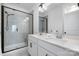 Modern bathroom featuring double sinks, a glass-enclosed shower with a built-in seat, and sleek fixtures at 791 Seigle Point Dr, Charlotte, NC 28204
