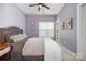 Charming bedroom with a comfortable bed, soft lighting, and soothing purple walls at 791 Seigle Point Dr, Charlotte, NC 28204