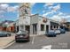 Commercial building with modern design, ample parking, and vibrant signage under a partly cloudy sky at 791 Seigle Point Dr, Charlotte, NC 28204