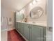 Bathroom showcasing a double sink vanity, neutral colors, and ample space for comfort at 8603 Bookwalter Ct, Charlotte, NC 28277