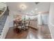 Bright dining area adjacent to kitchen features hardwood floors and staircase at 8603 Bookwalter Ct, Charlotte, NC 28277