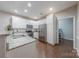 Well-lit kitchen boasts granite countertops, stainless steel appliances, and white cabinets at 8603 Bookwalter Ct, Charlotte, NC 28277