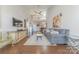 Spacious living room featuring hardwood floors, a soaring ceiling, and stylish decor at 8603 Bookwalter Ct, Charlotte, NC 28277