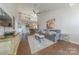 Bright living room with a high ceiling, hardwood floors, and an open layout to the second floor at 8603 Bookwalter Ct, Charlotte, NC 28277