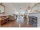 Cozy living room featuring a fireplace, hardwood floors, and an open design at 8603 Bookwalter Ct, Charlotte, NC 28277
