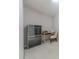 Compact office space with sewing machine and storage cabinet at 8603 Bookwalter Ct, Charlotte, NC 28277