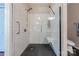 Modern walk-in shower with subway tile, bench seat, and grab bars at 8603 Bookwalter Ct, Charlotte, NC 28277