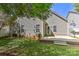 A backyard with a concrete patio, steps, a grassy area, and vinyl siding on the home at 9189 Glenashley Dr, Cornelius, NC 28031