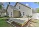 A backyard featuring a concrete patio, steps, a grassy area, and vinyl siding at 9189 Glenashley Dr, Cornelius, NC 28031