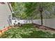 Backyard featuring a white privacy fence and some trees and grassy areas at 9189 Glenashley Dr, Cornelius, NC 28031