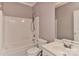 Bathroom featuring tub and shower combo, toilet, and single sink vanity at 9189 Glenashley Dr, Cornelius, NC 28031