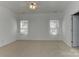 Spacious bedroom with large windows and ceiling fan at 9189 Glenashley Dr, Cornelius, NC 28031