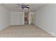 A spacious carpeted bonus room with a ceiling fan, closet and two entry doors at 9189 Glenashley Dr, Cornelius, NC 28031