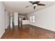 Spacious living area with hardwood floors, ceiling fan, and open access to other living spaces, creating a great flow at 9189 Glenashley Dr, Cornelius, NC 28031