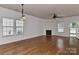 Bright living room with hardwood floors, fireplace, and ample natural light, perfect for relaxing and entertaining at 9189 Glenashley Dr, Cornelius, NC 28031