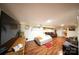 Cozy finished basement with wood flooring, comfy couches, and a neatly made bed for flexible living space at 9716 Sunway Dr, Mint Hill, NC 28227