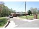 Charming single-story brick home with a well-maintained lawn, paved drive and a brick gate adding curb appeal at 9716 Sunway Dr, Mint Hill, NC 28227