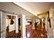 Featuring hardwood floors, columns, and doorways, this is the hallway at 9716 Sunway Dr, Mint Hill, NC 28227