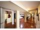 Featuring hardwood floors, columns, and doorways, this is the hallway at 9716 Sunway Dr, Mint Hill, NC 28227
