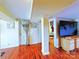 Hallway shot featuring wood floors, a storage cabinet, and doorway at 9716 Sunway Dr, Mint Hill, NC 28227