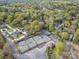 Aerial view of community tennis courts, mature trees, and neighborhood streets at 10 North Rd, Salisbury, NC 28144