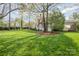 Large backyard with a wooden deck and patio area providing ample space for outdoor enjoyment at 10 North Rd, Salisbury, NC 28144