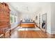 Sunlit bedroom boasts hardwood floors, large windows, and a ceiling fan at 10 North Rd, Salisbury, NC 28144