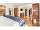 Bright bedroom featuring hardwood floors, large closets, and an ensuite bathroom at 10 North Rd, Salisbury, NC 28144