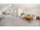 Bright bonus room with cozy seating area, desk space and neutral color palette at 10 North Rd, Salisbury, NC 28144